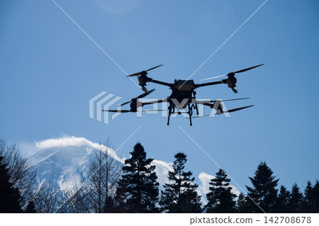 Drones and snow-covered mountains Drones and snow-covered mountains 142708678
