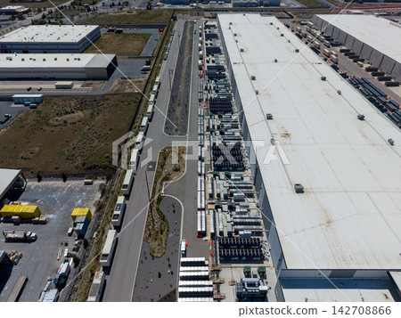 Aerial view of a large data center facility and cooling equipment 142708866