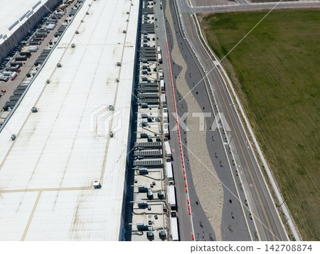 High angle drone view of a large data center and cooling units 142708874