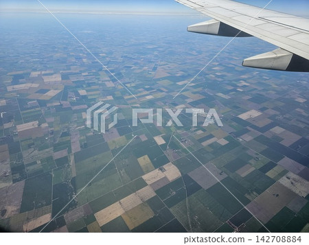 Airplane Wing Above Patchwork Farmland on Flight from Buenos Aires to Cordoba 142708884