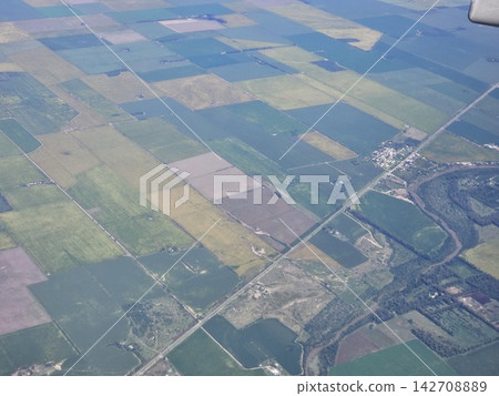 Aerial View of Industrial Excavation Site Among Agricultural Fields 142708889