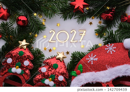 Abstract background of Christmas attributes with the year number 2027. Abstract background of Christmas attributes with the year number 2027. 142709439