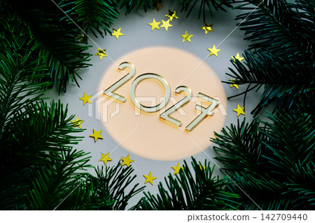 Yellow New Year's background with the number of the coming year 2027. Yellow New Year's background with the number of the coming year 2027. 142709440