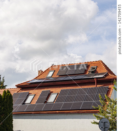Solar Panels Installed on Red Tile Roof of Residential Building Solar Panels Installed on Red Tile Roof of Residential Building 142709455