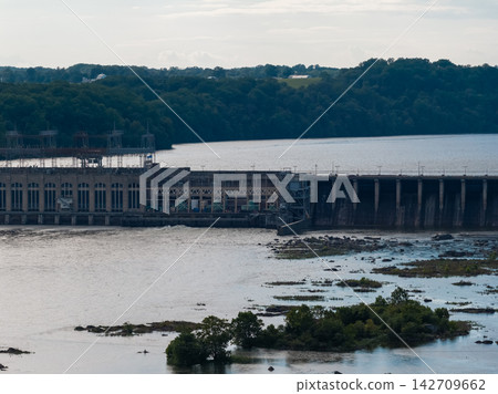 Aerial view of a large hydroelectric power plant on a wide river Aerial view of a large hydroelectric power plant on a wide river 142709662