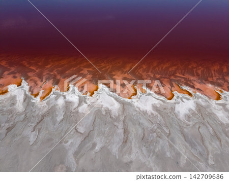 An aerial view shows the vibrant red Great Salt Lake textures An aerial view shows the vibrant red Great Salt Lake textures 142709686