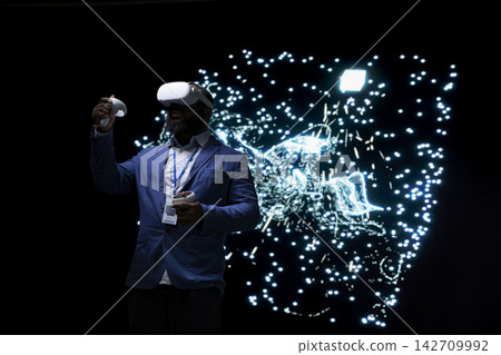 Programmer optimizing AI agent using virtual reality simulation, adjusting artificial neurons. Computer scientist uses VR headset gear to look at neural network architecture visualization 142709992