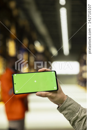 Isolated mockup on mobile phone with staff member working on cargo dispatch, ensuring import export preparation. Professional environment highlighting operational logistics workflow. Isolated mockup on mobile phone with staff member working on cargo dispatch, ensuring import export preparation. Professional environment highlighting operational logistics workflow. 142710107