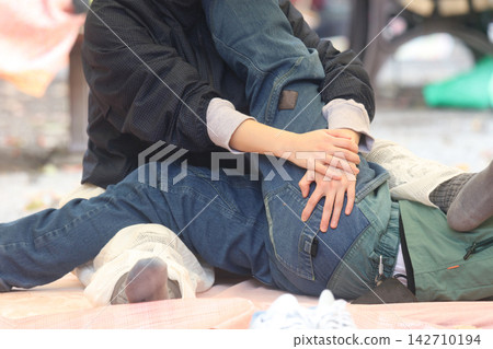 Woman doing bodywork Woman doing bodywork 142710194