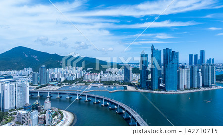 Aerial View of Gwangan Bridge, Marine City Skyline, and Dongbaekseom Island in Busan, South Korea Aerial View of Gwangan Bridge, Marine City Skyline, and Dongbaekseom Island in Busan, South Korea 142710715