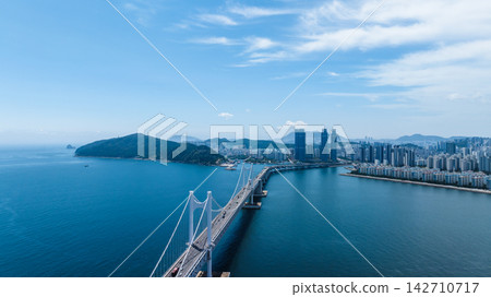 Aerial View of Gwangan Bridge, Marine City Skyline, and Dongbaekseom Island in Busan, South Korea Aerial View of Gwangan Bridge, Marine City Skyline, and Dongbaekseom Island in Busan, South Korea 142710717