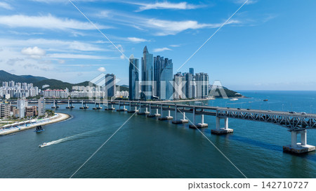Aerial View of Gwangan Bridge, Marine City Skyline, and Dongbaekseom Island in Busan, South Korea Aerial View of Gwangan Bridge, Marine City Skyline, and Dongbaekseom Island in Busan, South Korea 142710727