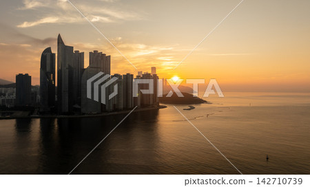 Aerial View of Gwangan Bridge, Marine City Skyline, and Dongbaekseom Island in Busan, South Korea 142710739