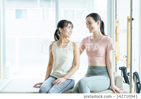 Pilates studio, female instructor Pilates studio, female instructor 142710941