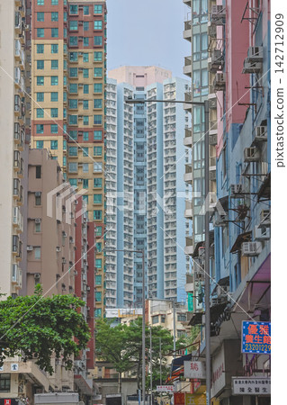 Hong Kong Aug 29 2026 Fung Tak Road street view framed by high-rises Hong Kong Aug 29 2026 Fung Tak Road street view framed by high-rises 142712909