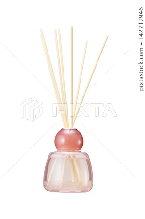 Pink glass bottle reed diffuser with rattan sticks and crystals, white background. Pink glass bottle reed diffuser with rattan sticks and crystals, white background. 142712946
