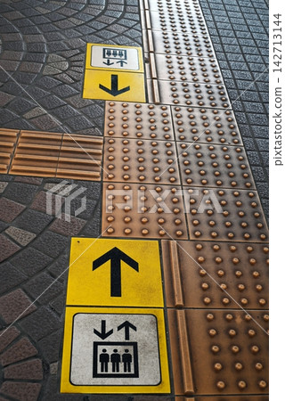 Tactile paving for the visually impaired at the train station Tactile paving for the visually impaired at the train station 142713144