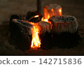 A comforting, warm charcoal fire 142715836