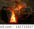 The charcoal fire crackles 142715837