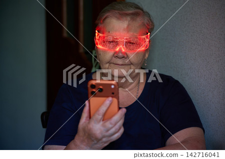 Senior Woman Using Smartphone with LED Glasses Senior Woman Using Smartphone with LED Glasses 142716041