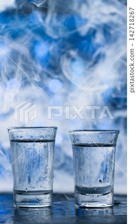 Two Cold Vodka Shots With Smoke Two Cold Vodka Shots With Smoke 142718267