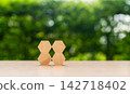 Hexagonal wooden blocks form a connected pattern, symbolizing teamwork and collaboration. 142718402