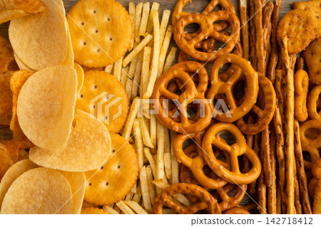 Mix of variety snack chips pretzel and cracker, junk crunchy food. Mix of variety snack chips pretzel and cracker, junk crunchy food. 142718412