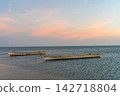 Landscape of paradise tropical beach, sunrise, sunset shot, with a boat 142718804