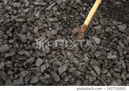 Dark coal litters the ground, coarse and wet Dark coal litters the ground, coarse and wet 142718891