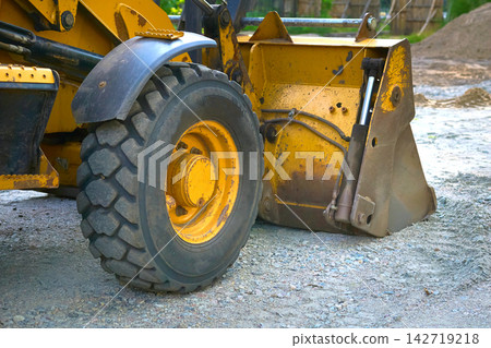Construction moment. Road scraper bulldozer working on site Construction moment. Road scraper bulldozer working on site 142719218