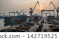 A construction site with huge cranes 142719525
