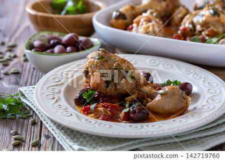 Roasted Chicken with Olives and Tomatoes. Roasted Chicken with Olives and Tomatoes. 142719760