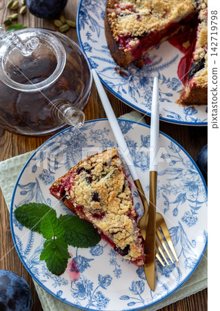 Piece of traditional German plum pie (Pflaumenkuchen). Piece of traditional German plum pie (Pflaumenkuchen). 142719798