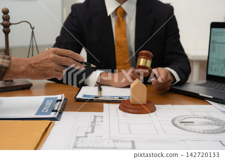 Concept of construction law, real estate development, renewable energy housing, and engineering collaboration. Concept of construction law, real estate development, renewable energy housing, and engineering collaboration. 142720133