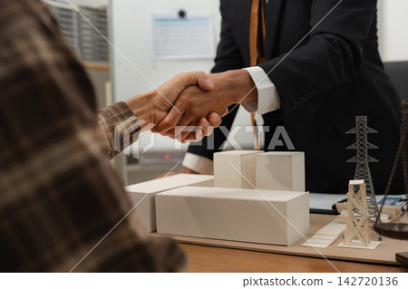 Concept of construction law, real estate development, renewable energy housing, and engineering collaboration. Concept of construction law, real estate development, renewable energy housing, and engineering collaboration. 142720136