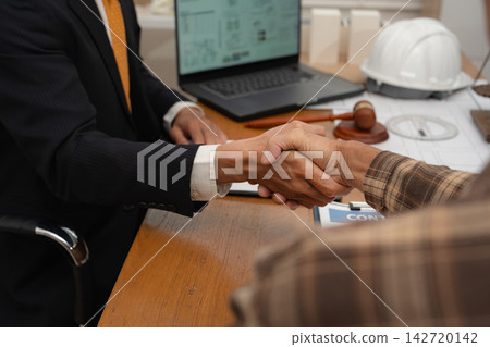 Concept of construction law, real estate development, renewable energy housing, and engineering collaboration. Concept of construction law, real estate development, renewable energy housing, and engineering collaboration. 142720142