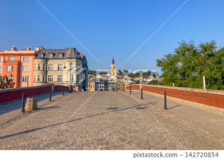 Morning walk across Kamienny Most offers scenic river views and a peaceful atmosphere surrounded by historic urban architecture in Przemysl, Poland Morning walk across Kamienny Most offers scenic river views and a peaceful atmosphere surrounded by historic urban architecture in Przemysl, Poland 142720854