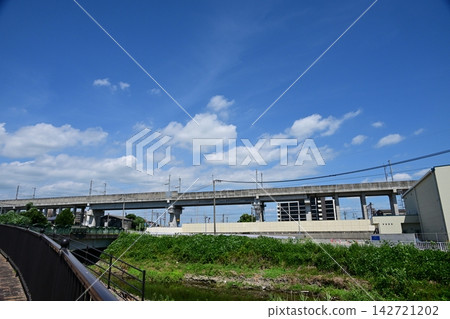 Wide pedestrian walkways and the elevated tracks of the Kyushu Shinkansen. Wide pedestrian walkways and the elevated tracks of the Kyushu Shinkansen. 142721202