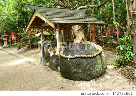Round stone shrine and water basin Round stone shrine and water basin 142721661