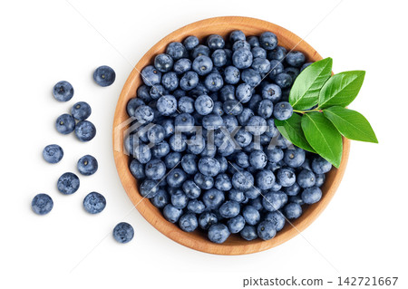 blueberry in wooden bowl isolated on white background. Top view. Flat lay blueberry in wooden bowl isolated on white background. Top view. Flat lay 142721667