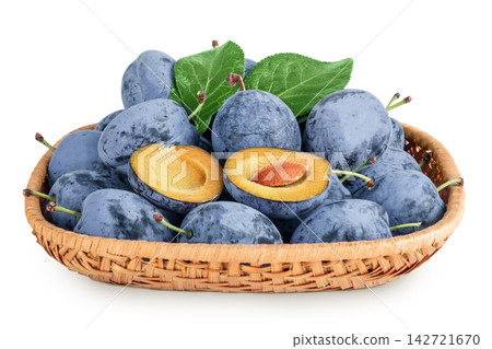 fresh blue plum in wicker basket isolated on white background. fresh blue plum in wicker basket isolated on white background. 142721670