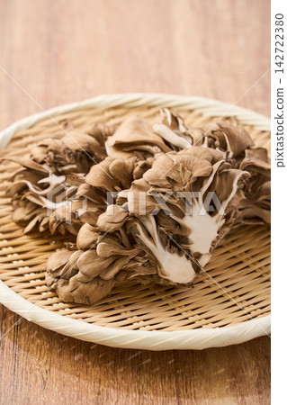 Raw maitake mushrooms served on a bamboo basket. Raw maitake mushrooms served on a bamboo basket. 142722380
