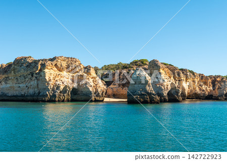 Golden cliffs of Algarve coastline in Portugal Golden cliffs of Algarve coastline in Portugal 142722923
