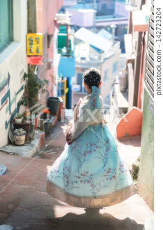 Korean girl in traditional blue Hanbok view Gamcheon village, Busan Korean girl in traditional blue Hanbok view Gamcheon village, Busan 142723204