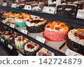 Colorful whole cakes lined up in the display case of a cake shop in Keelung, Taiwan. 142724879