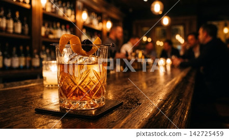 Cinematic photography of a premium Old Fashioned whiskey cocktail in a crystal glass with warm lighting. Cinematic photography of a premium Old Fashioned whiskey cocktail in a crystal glass with warm lighting. 142725459