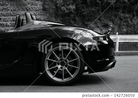 shiny black open car shiny black open car 142726050