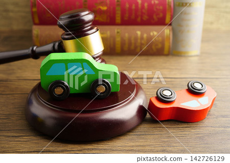 Car accident lawsuit and insurance, Judge hammer with car model. Car accident lawsuit and insurance, Judge hammer with car model. 142726129