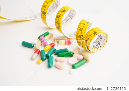 Measuring tape and tablet drug medical for diet. Measuring tape and tablet drug medical for diet. 142726133
