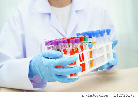 Scientist medical professional use test tube for research in science laboratory. 142726175